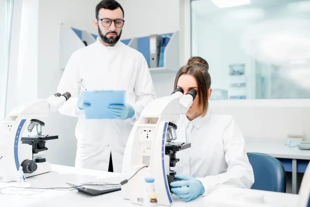 Medics working with microscope at the laboratory 2023 11 27 05 34 25 utc
